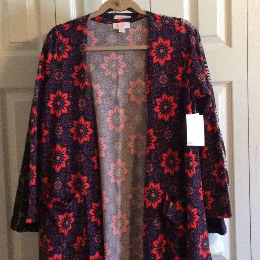 NWT Lularoe Sarah Sweater, size Medium. Floral pattern in red, green, blue